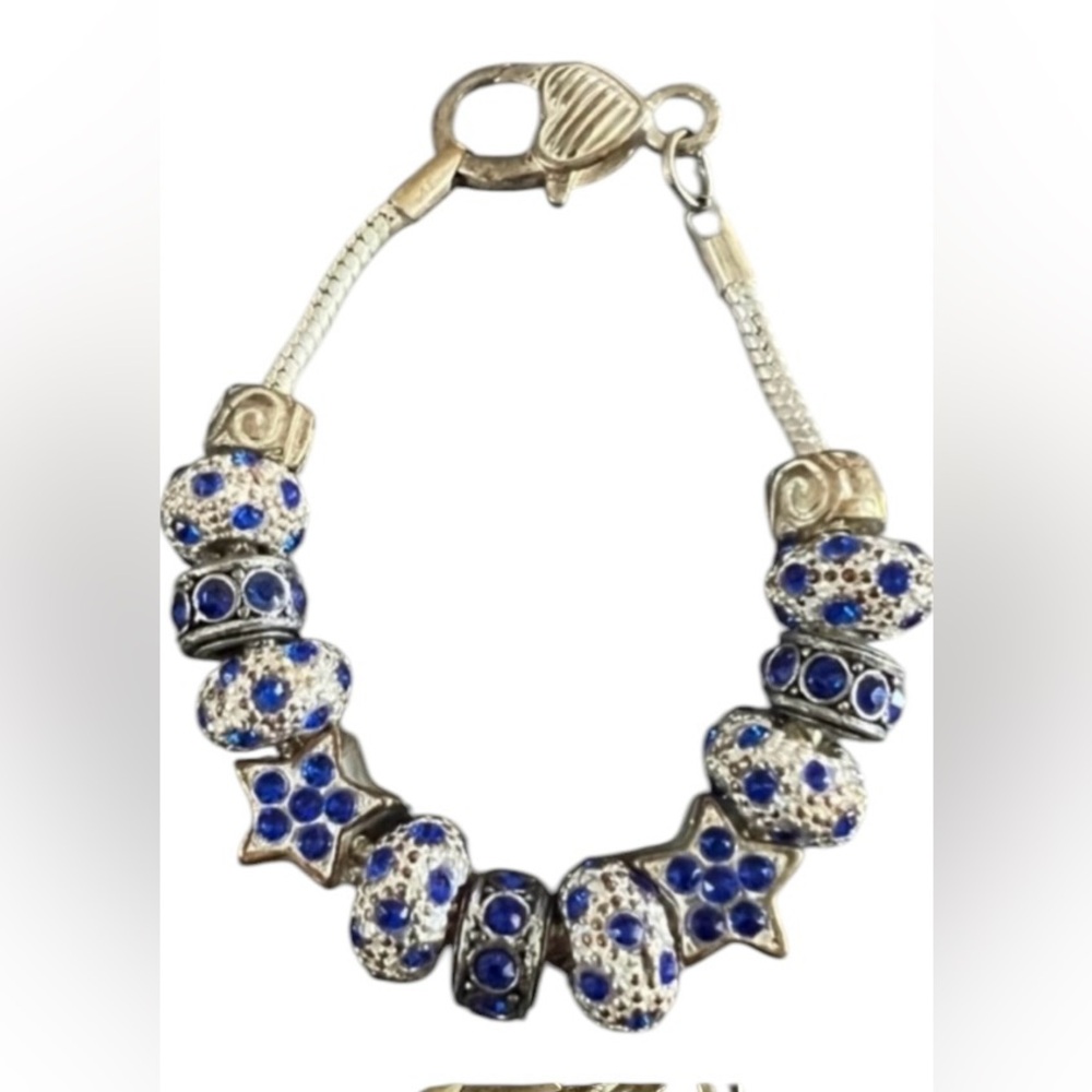 Silver tone clasp snake chain bracelet with silver and blue charms